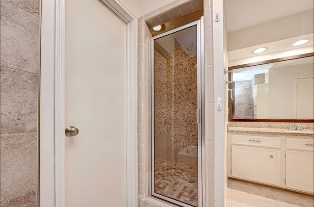 a view of a bathroom with mirror