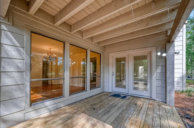 a view of front door of house with wooden floor