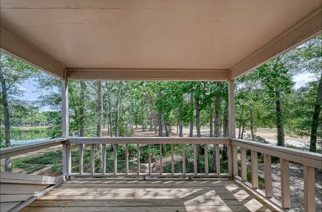 a view of a porch with wooden floor and outdoor space