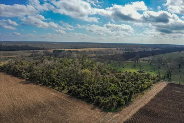 a view of a lake with a yard