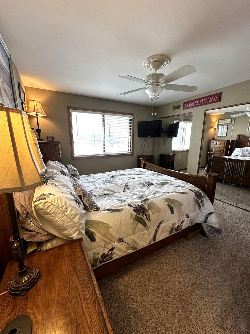 16806 82nd Avenue, Unit 3S Tinley Park, IL 60477 - Photo 7 of 14 a bed sitting in a bedroom next to a window