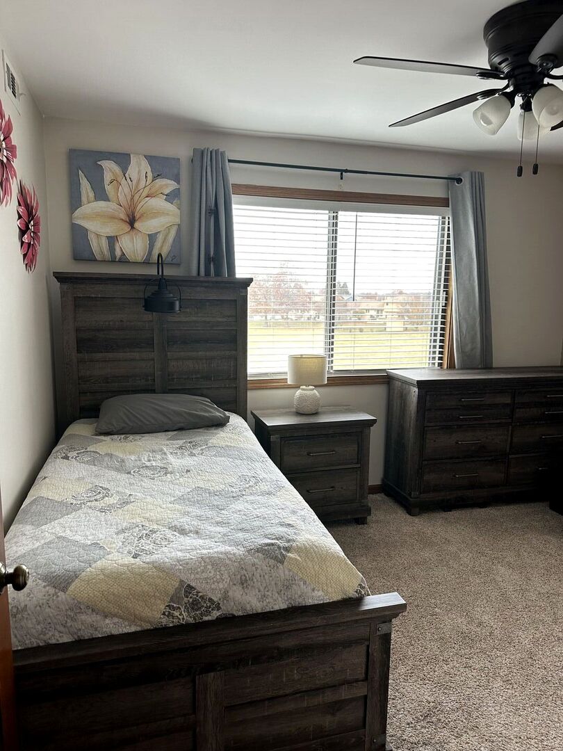 16806 82nd Avenue, Unit 3S Tinley Park, IL 60477 - Photo 9 of 14 a bedroom with a bed and a window