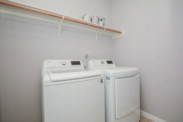 a utility room with dryer and washer
