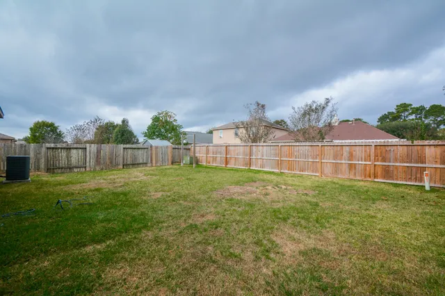 a view of a backyard with green space