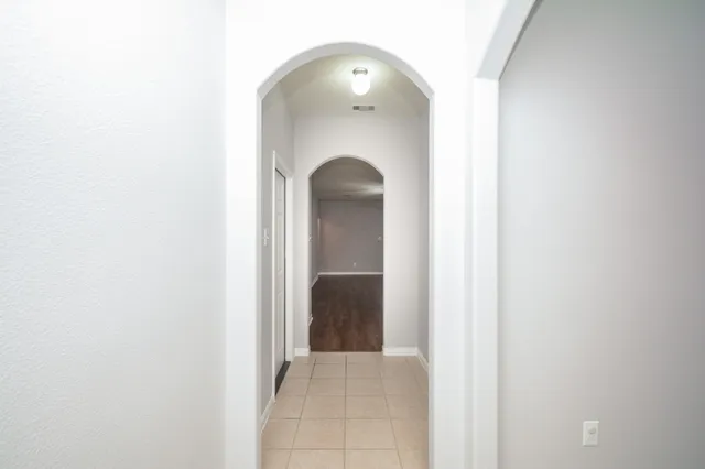 a view of a room that has a mirror in it