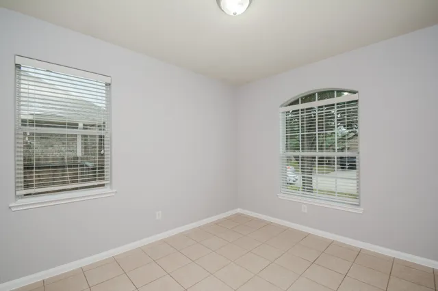 a view of an empty room with windows