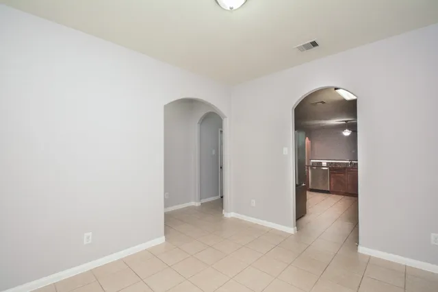 an empty room with a bathroom