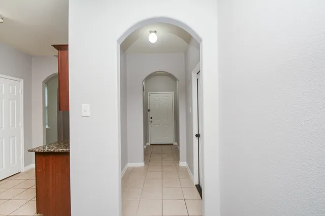 a view of a room that has a mirror in it