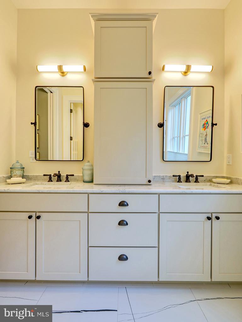 35975 Goshawk Court Lewes, DE 19958 - Photo 37 of 94 a bathroom with a sink vanity and mirror