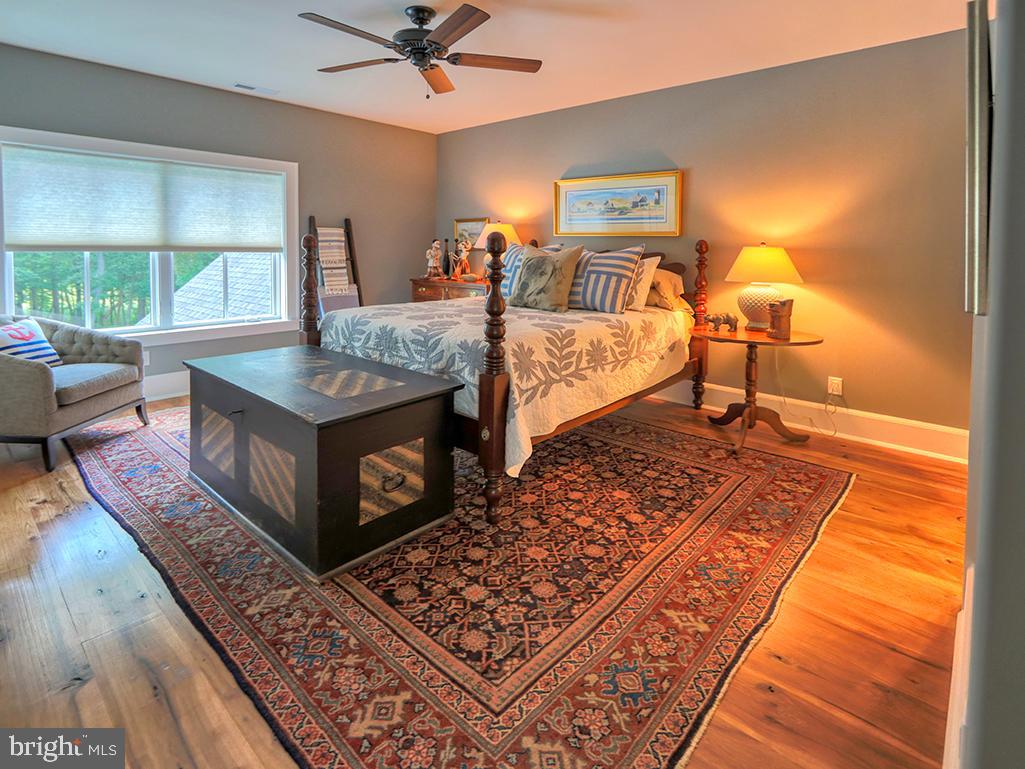 35975 Goshawk Court Lewes, DE 19958 - Photo 49 of 94 a bed room with a bed and a night stand