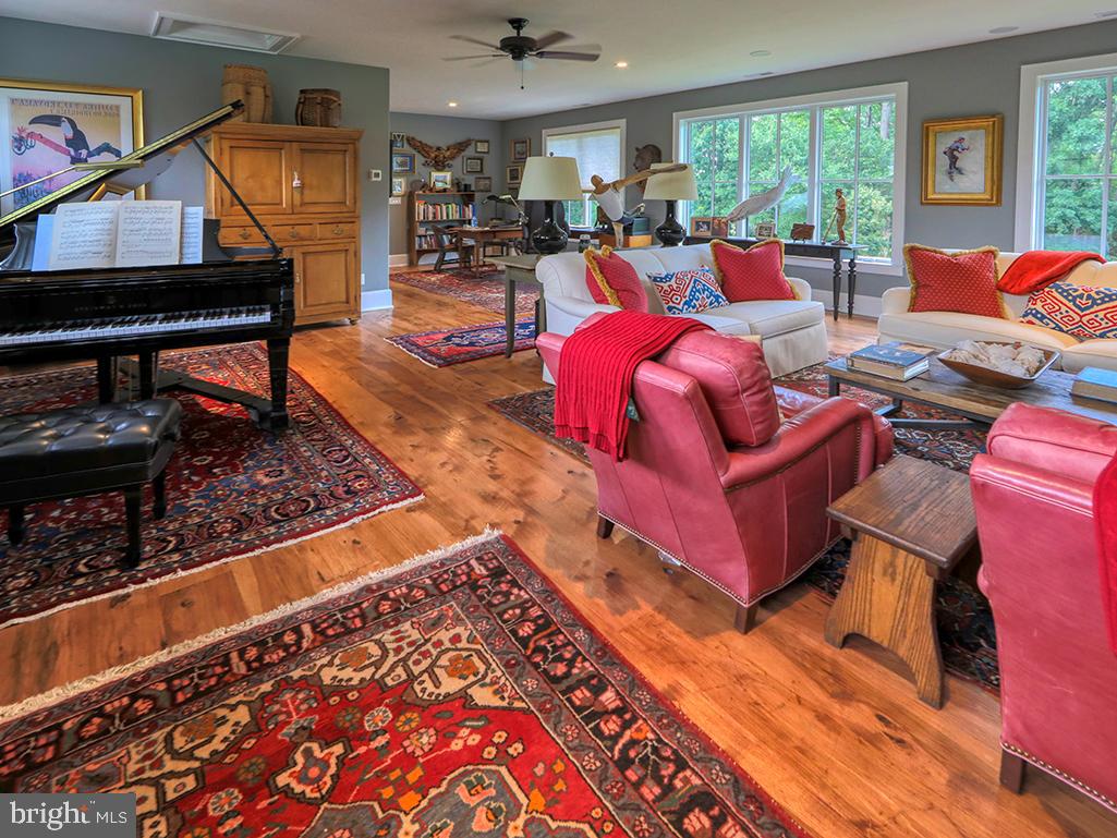 35975 Goshawk Court Lewes, DE 19958 - Photo 60 of 94 a living room with furniture a rug and a table