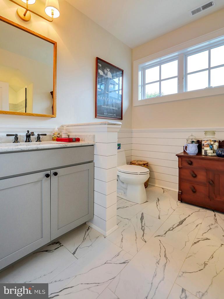 35975 Goshawk Court Lewes, DE 19958 - Photo 63 of 94 a bathroom with a toilet sink and mirror