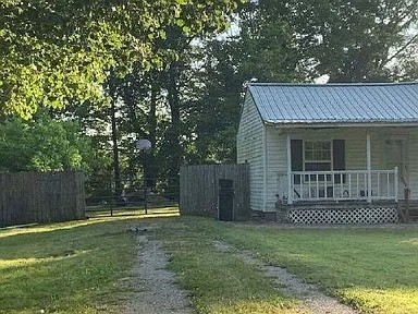 1047 Perry Switch Road Jackson, TN 38301 - Photo 2 of 36 a view of a house with a backyard