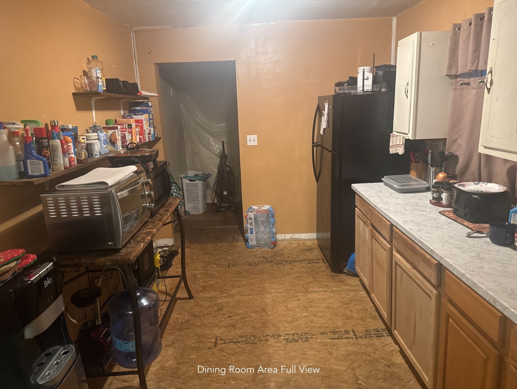 1047 Perry Switch Road Jackson, TN 38301 - Photo 23 of 36 a kitchen with refrigerator and washer