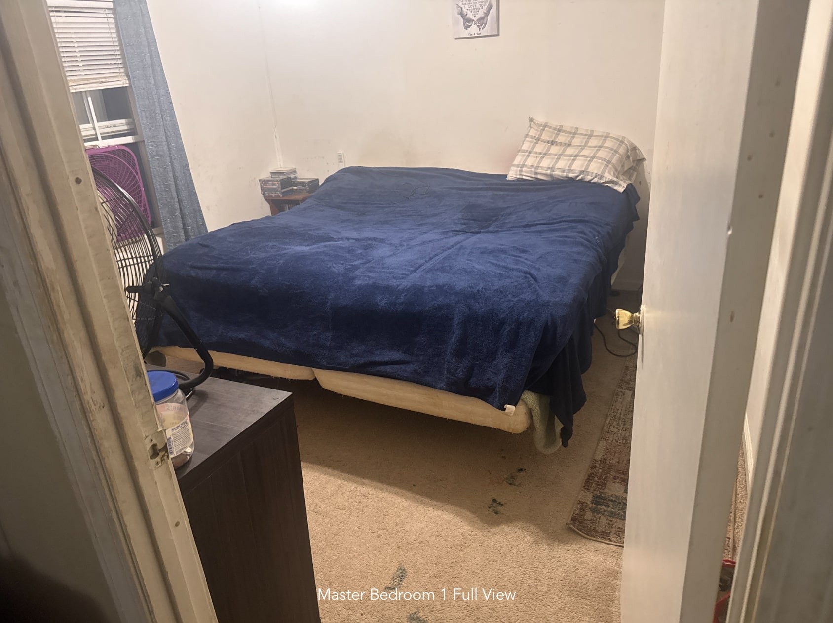 1047 Perry Switch Road Jackson, TN 38301 - Photo 28 of 36 a bedroom with a bed and a mirror