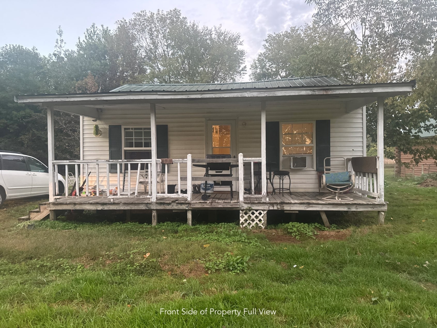 1047 Perry Switch Road Jackson, TN 38301 - Photo 5 of 36 front view of a house with a yard