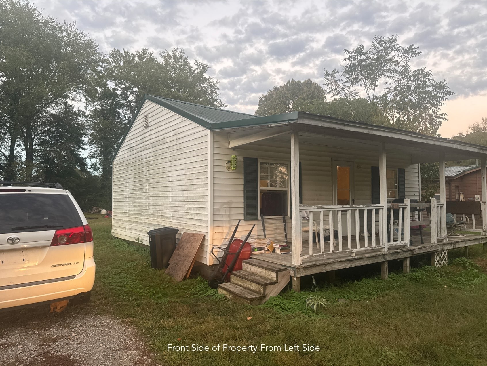 1047 Perry Switch Road Jackson, TN 38301 - Photo 6 of 36 a view of a chair and tables back yard of the house