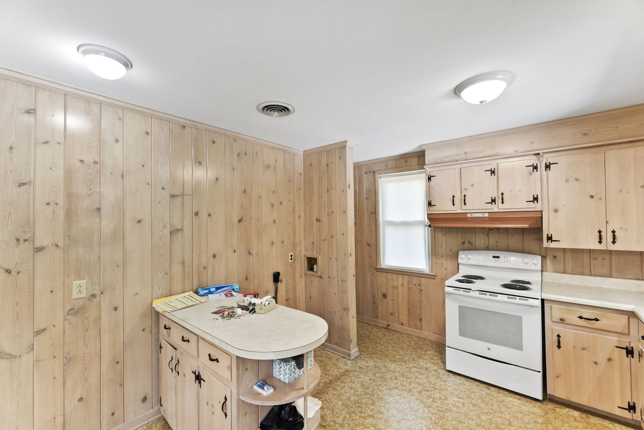 311 Bonnahurst Drive Hermitage, TN 37076 - Photo 11 of 47 a kitchen with a sink a stove a refrigerator and white cabinets