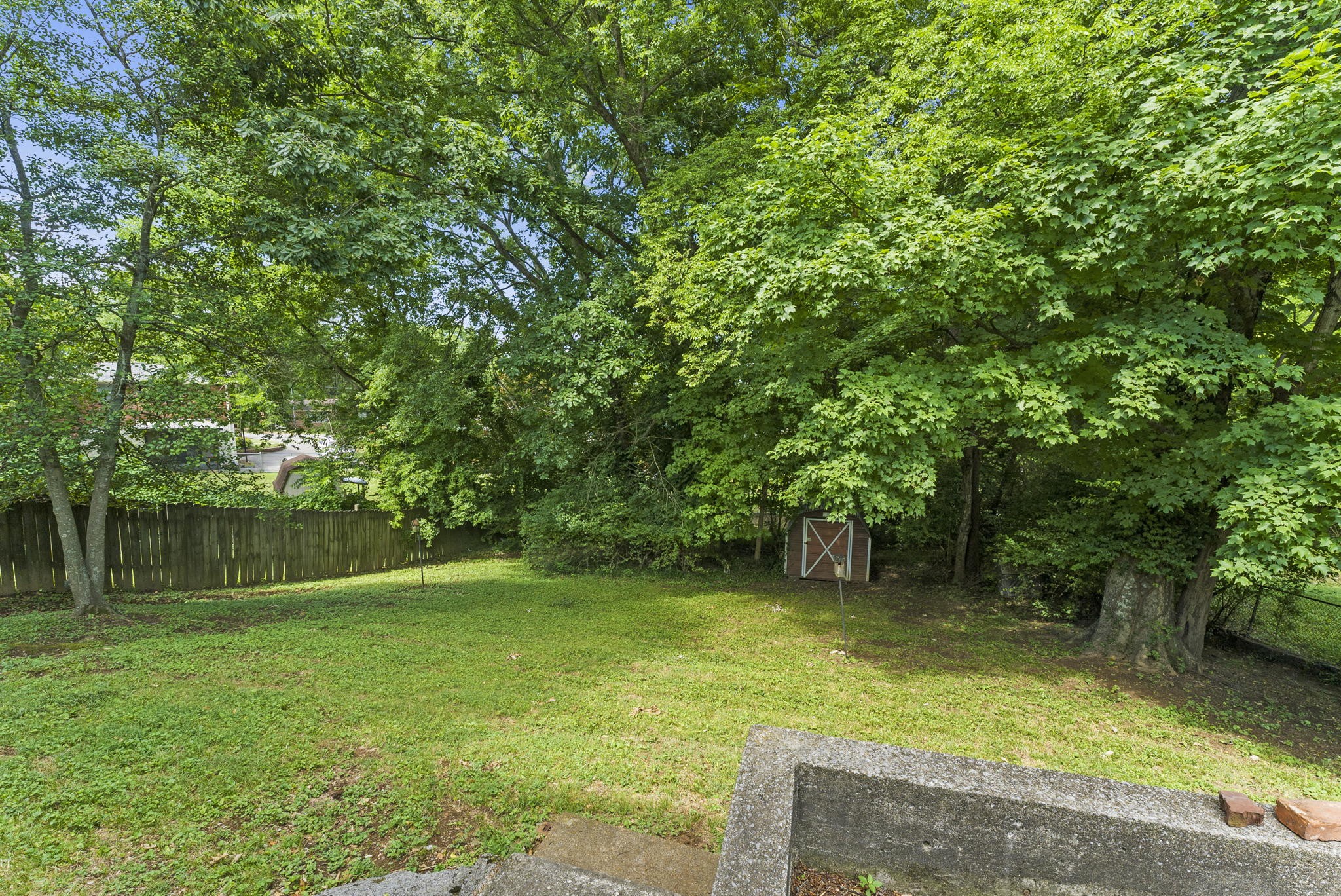 311 Bonnahurst Drive Hermitage, TN 37076 - Photo 45 of 47 a backyard of a house with lots of green space