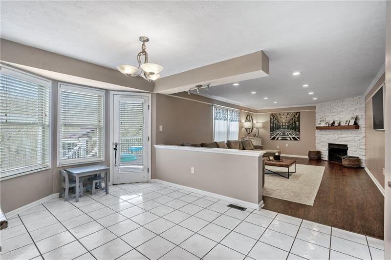 3013 Meyeridge Road Pittsburgh, PA 15209 - Photo 11 of 27 a living room with furniture a dining table and a large window