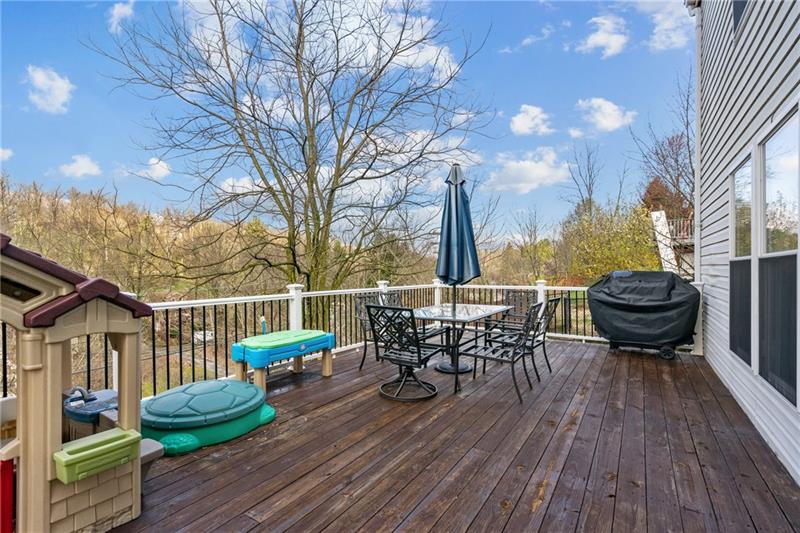 3013 Meyeridge Road Pittsburgh, PA 15209 - Photo 17 of 27 a view of a deck with table and chairs and wooden floor