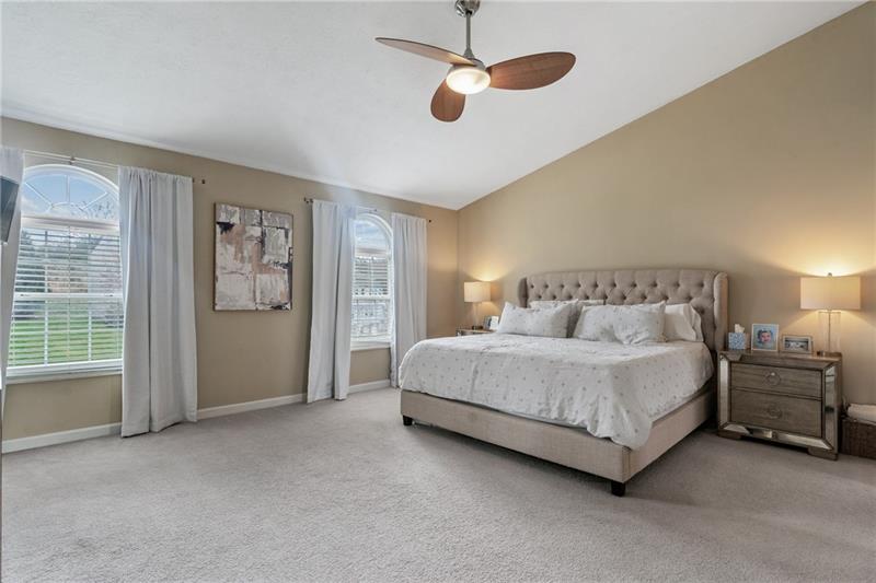3013 Meyeridge Road Pittsburgh, PA 15209 - Photo 18 of 27 a spacious bedroom with a bed chandelier and window