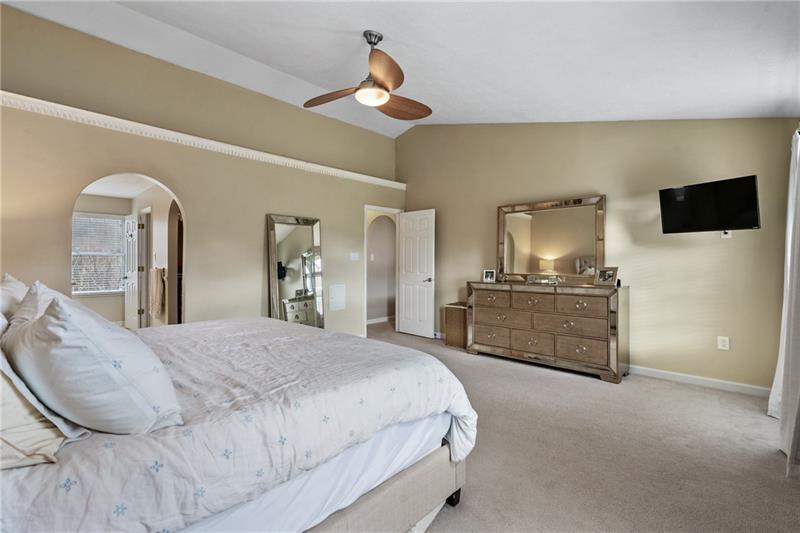 3013 Meyeridge Road Pittsburgh, PA 15209 - Photo 19 of 27 a bedroom with a bed a flat screen tv and dresser