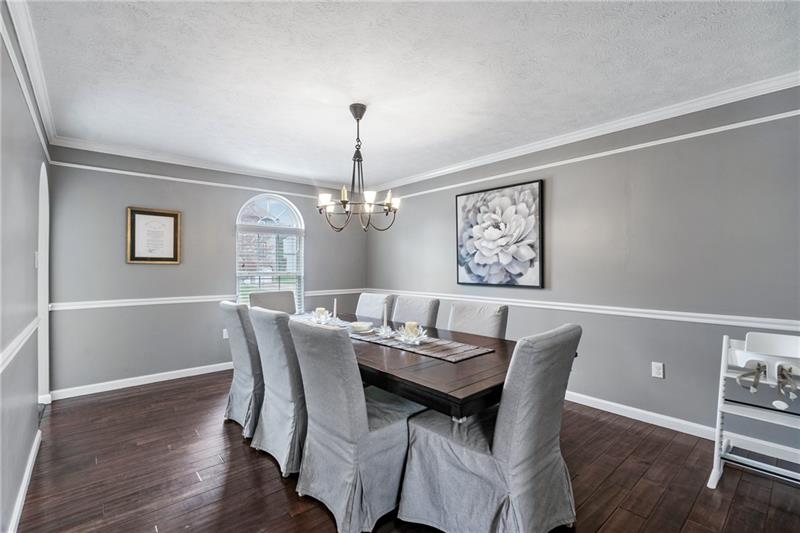 3013 Meyeridge Road Pittsburgh, PA 15209 - Photo 6 of 27 a view of a dining room with furniture wooden floor and a chandelier
