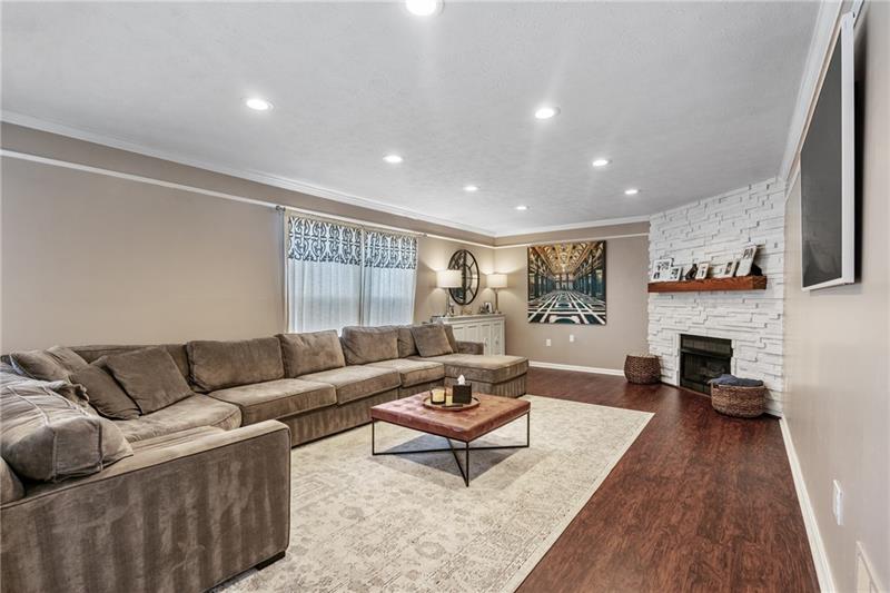 3013 Meyeridge Road Pittsburgh, PA 15209 - Photo 9 of 27 a living room with furniture and a fireplace