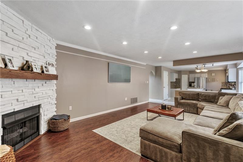 3013 Meyeridge Road Pittsburgh, PA 15209 - Photo 10 of 27 a living room with furniture and a fireplace