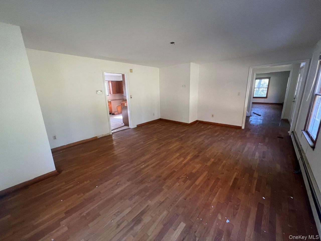 7 Felter Hill Road Monroe, NY 10950 - Photo 10 of 12 Spare room with baseboard heating and dark wood-style flooring