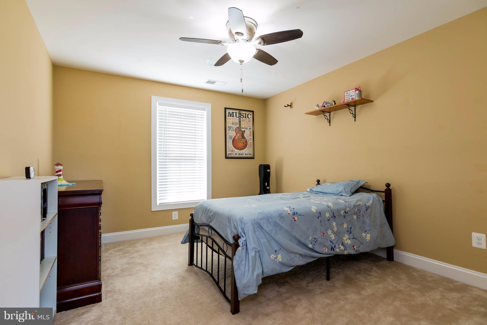 3333 Whispering Highland Road Finksburg, MD 21048 - Photo 13 of 30 a bedroom with a bed and a chandelier