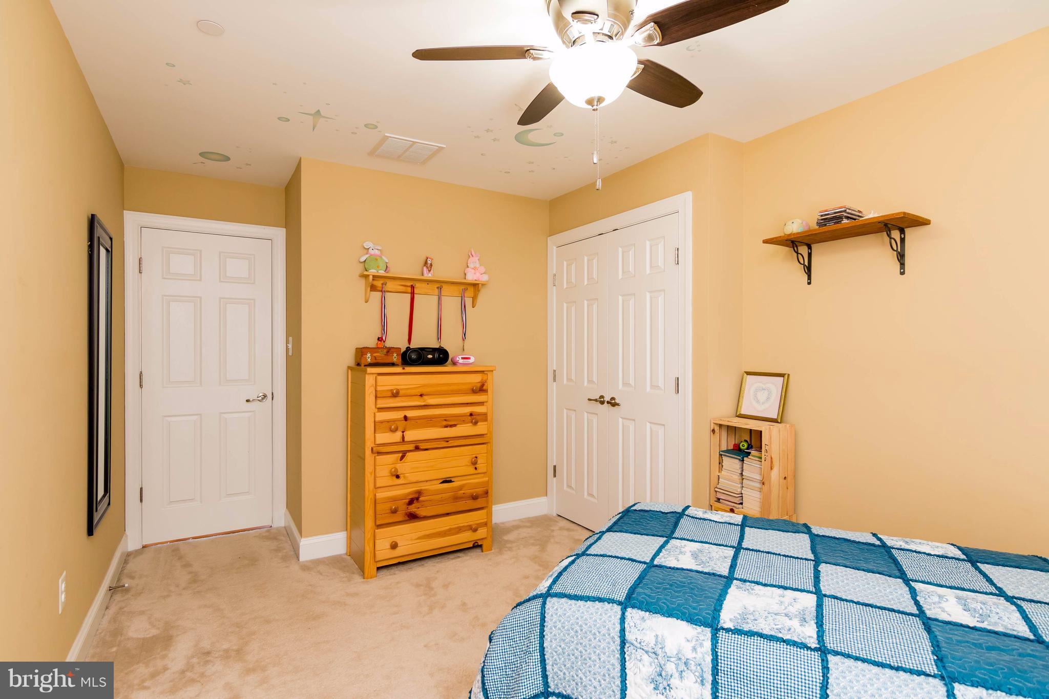 3333 Whispering Highland Road Finksburg, MD 21048 - Photo 14 of 30 a bedroom with a bed and a chandelier