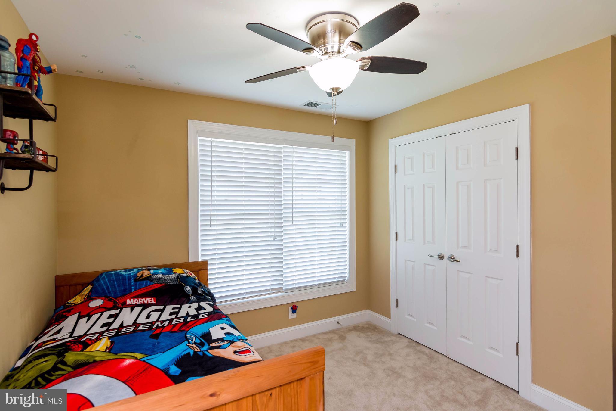 3333 Whispering Highland Road Finksburg, MD 21048 - Photo 15 of 30 a bedroom with a bed and a chandelier