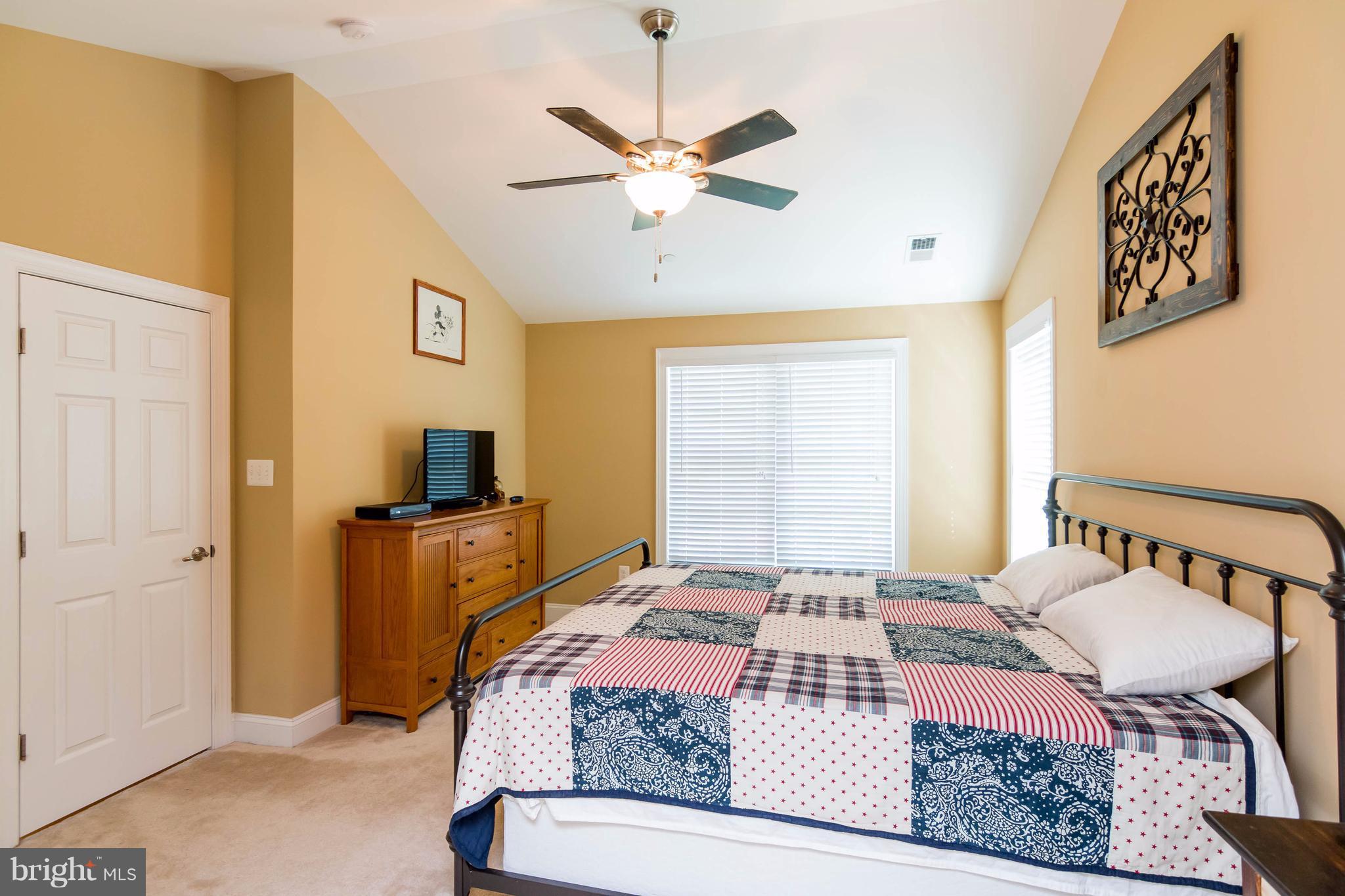3333 Whispering Highland Road Finksburg, MD 21048 - Photo 18 of 30 a bedroom with a bed and a table in it