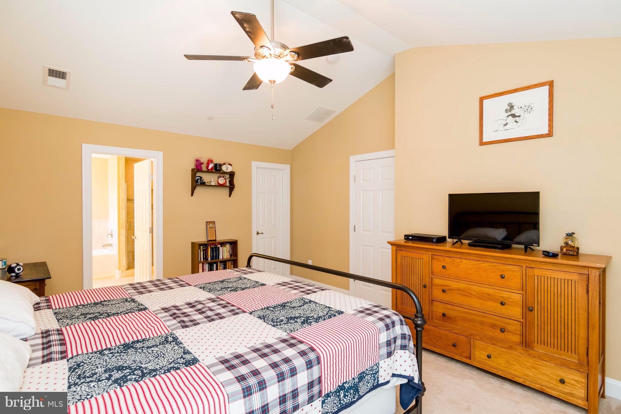 3333 Whispering Highland Road Finksburg, MD 21048 - Photo 19 of 30 a bedroom with a bed and a flat screen tv