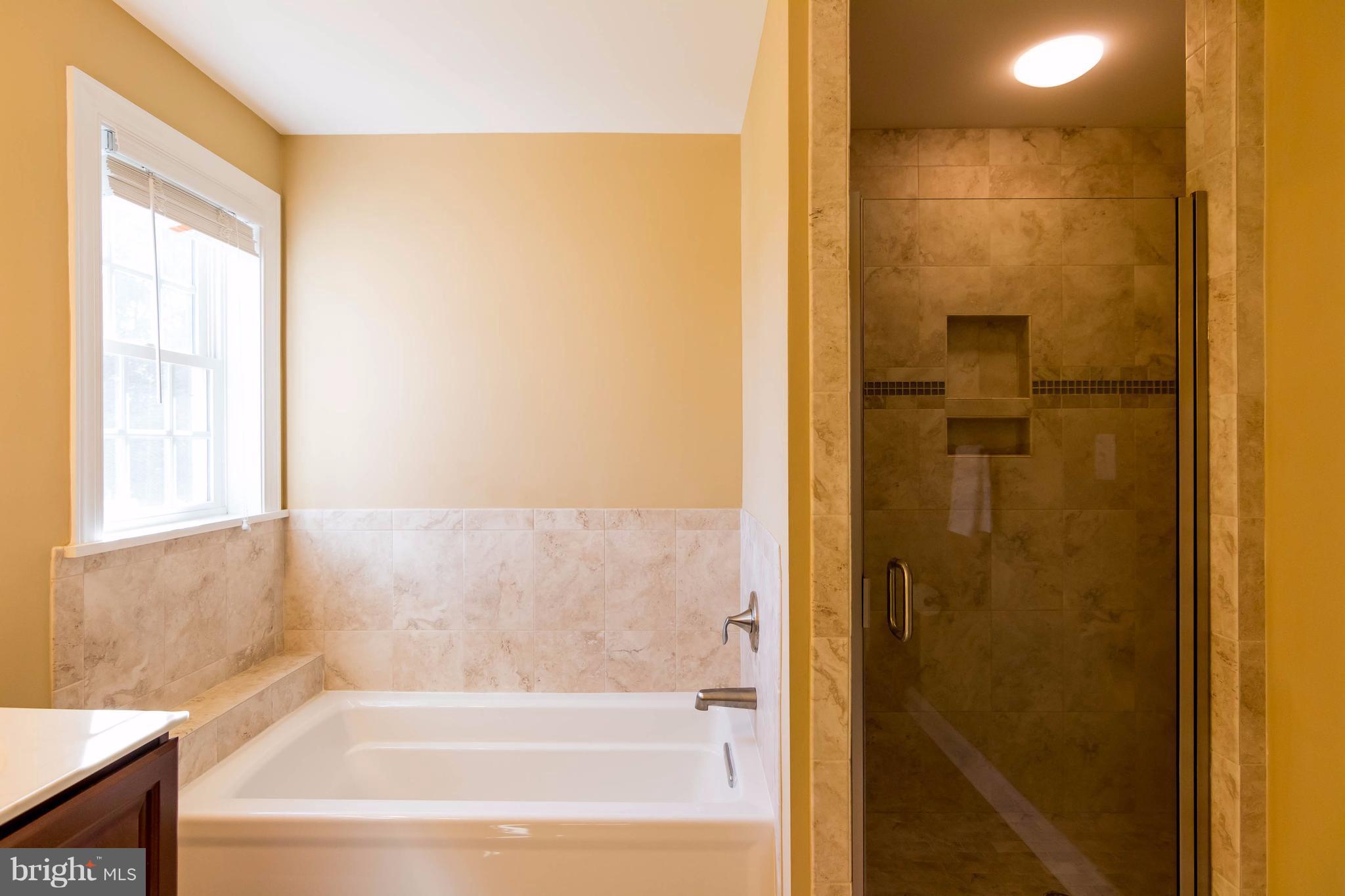 3333 Whispering Highland Road Finksburg, MD 21048 - Photo 21 of 30 a bathroom with a bathtub and shower