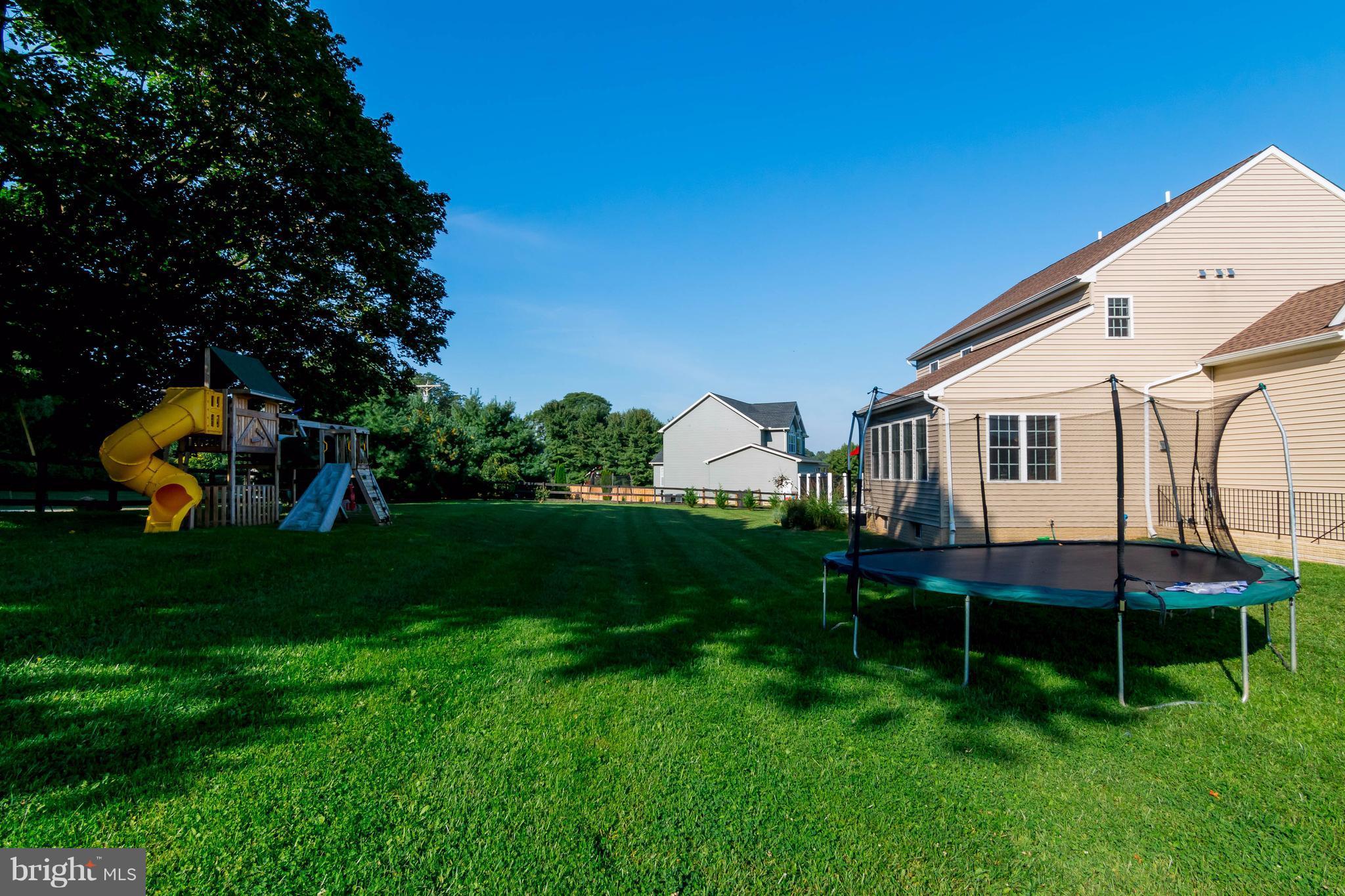 3333 Whispering Highland Road Finksburg, MD 21048 - Photo 28 of 30 a front view of a house with a yard table and chairs