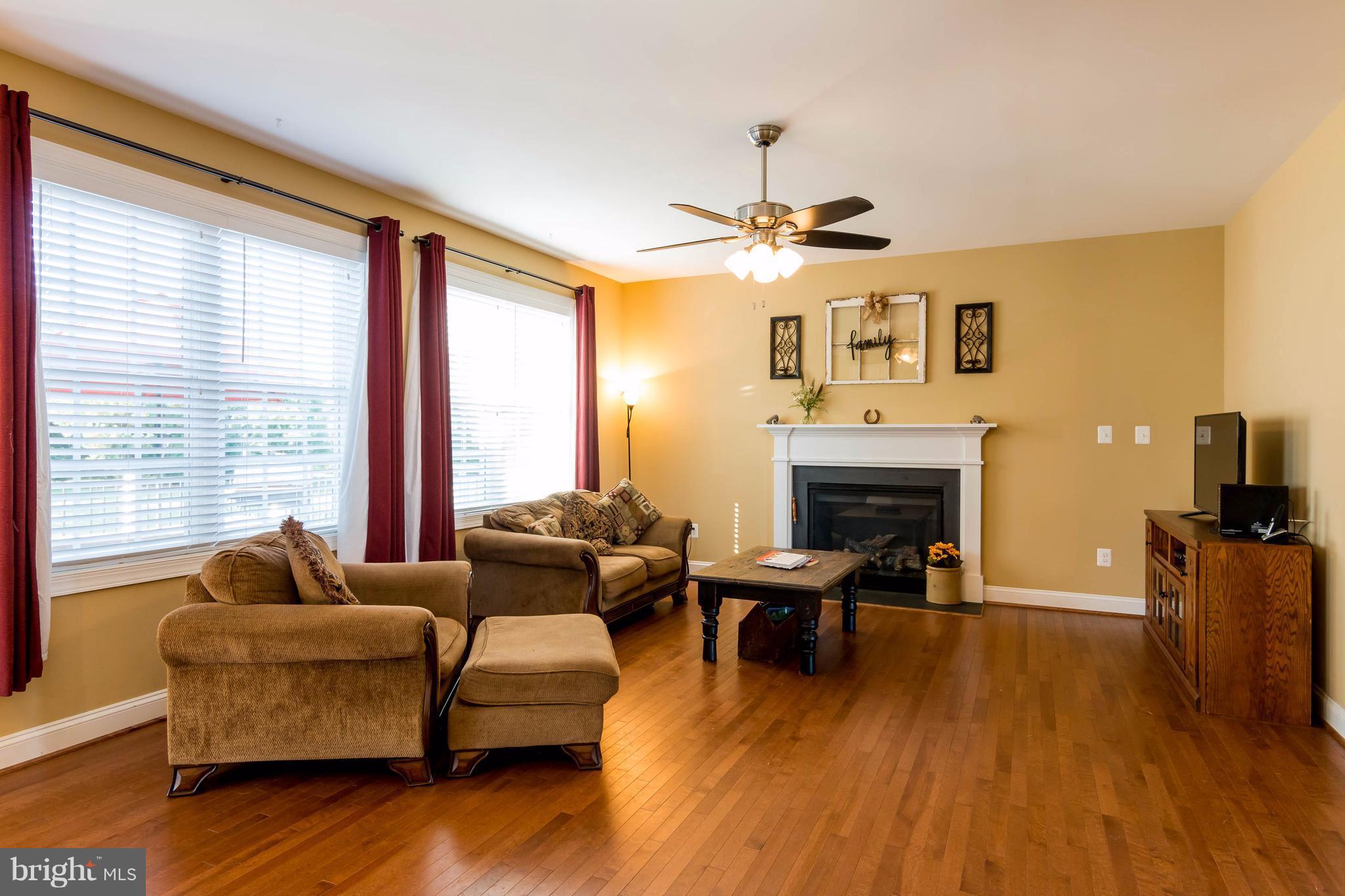 3333 Whispering Highland Road Finksburg, MD 21048 - Photo 6 of 30 a living room with furniture and a fireplace