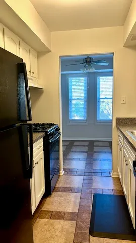 a kitchen with a sink and a stove