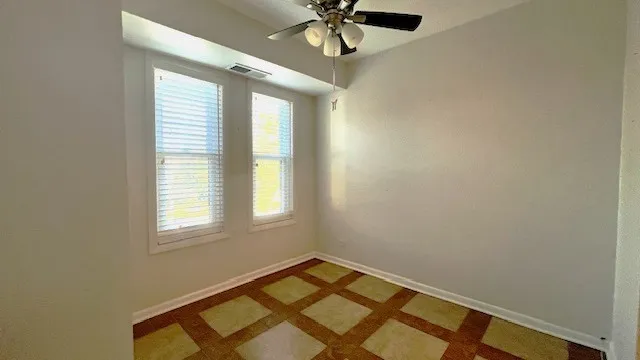 a view of an empty room and a window