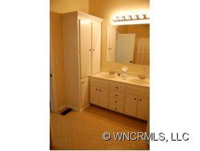 1594 Prince Road Columbus, NC 28722 - Photo 5 of 12 a view of a bathroom with a sink and a mirror