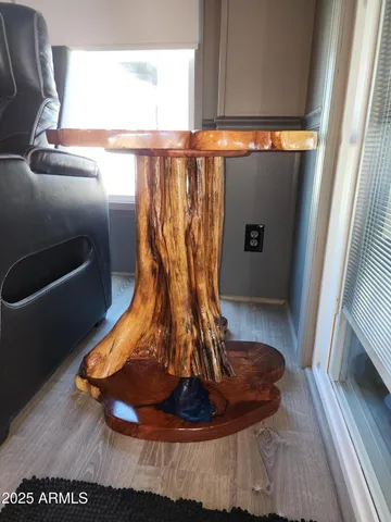 a view of entryway and hall with wooden floor