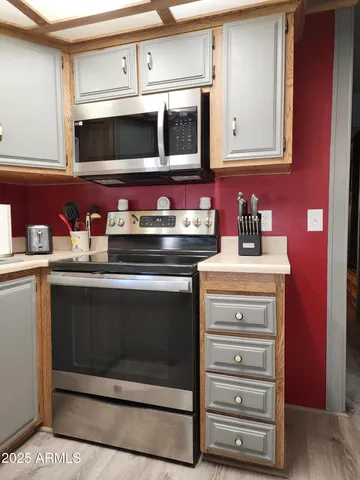 a bathroom with a shower a toilet and a sink