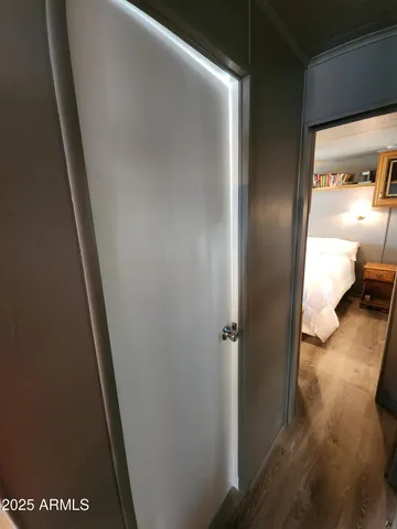 a bedroom with a bed and a television