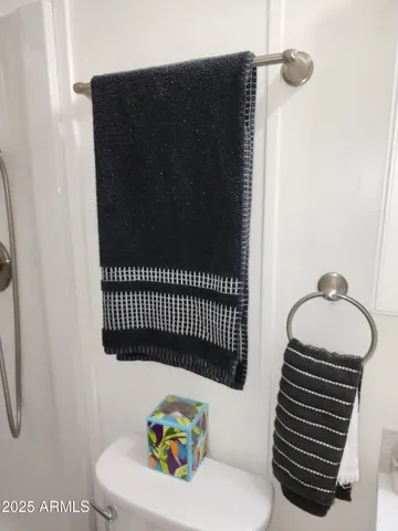 a view of a livingroom with furniture and white walls