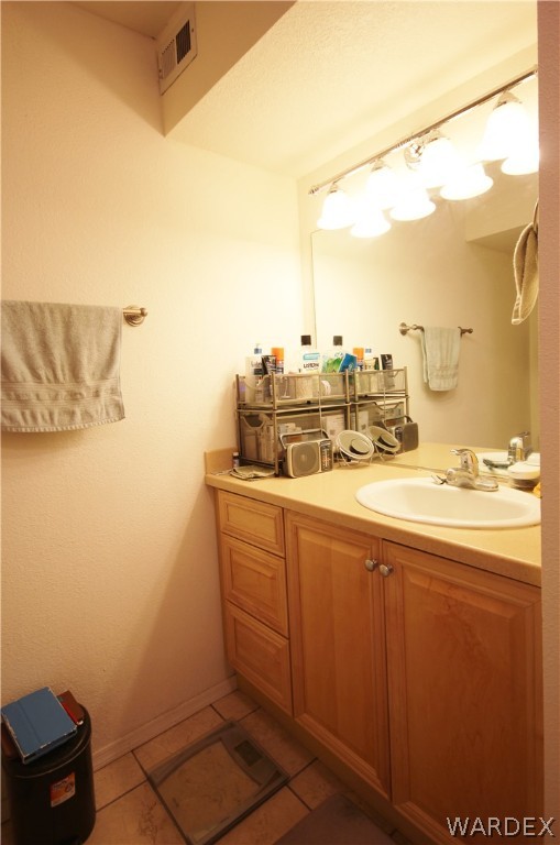 3408 Sunriver Road, Unit 109 Bullhead City, AZ 86429 - Photo 12 of 23 a bathroom with a sink and a mirror