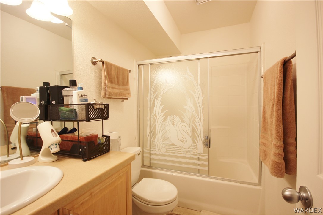 3408 Sunriver Road, Unit 109 Bullhead City, AZ 86429 - Photo 16 of 23 a bathroom with a sink toilet and shower