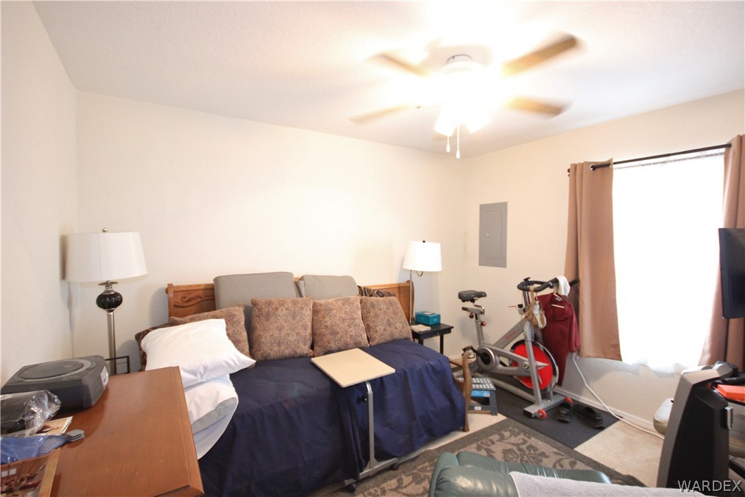 3408 Sunriver Road, Unit 109 Bullhead City, AZ 86429 - Photo 17 of 23 a living room with furniture and a window