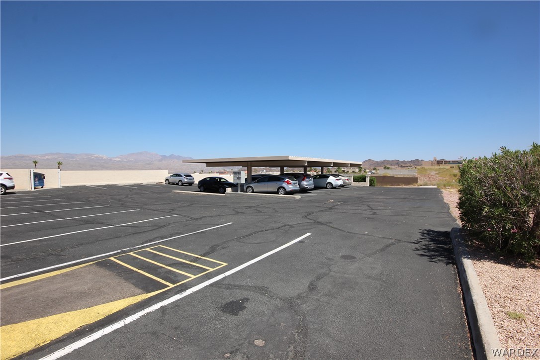 3408 Sunriver Road, Unit 109 Bullhead City, AZ 86429 - Photo 23 of 23 a view of car parked on the street side